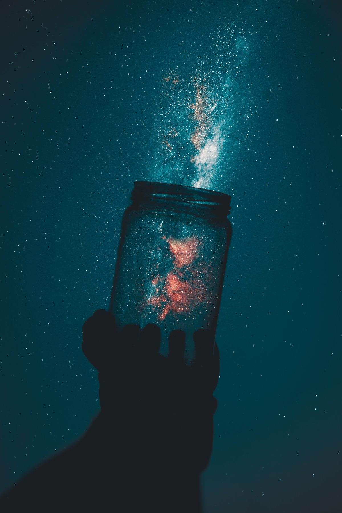 silhouette-of-person-holding-glass-mason-jar-1274260